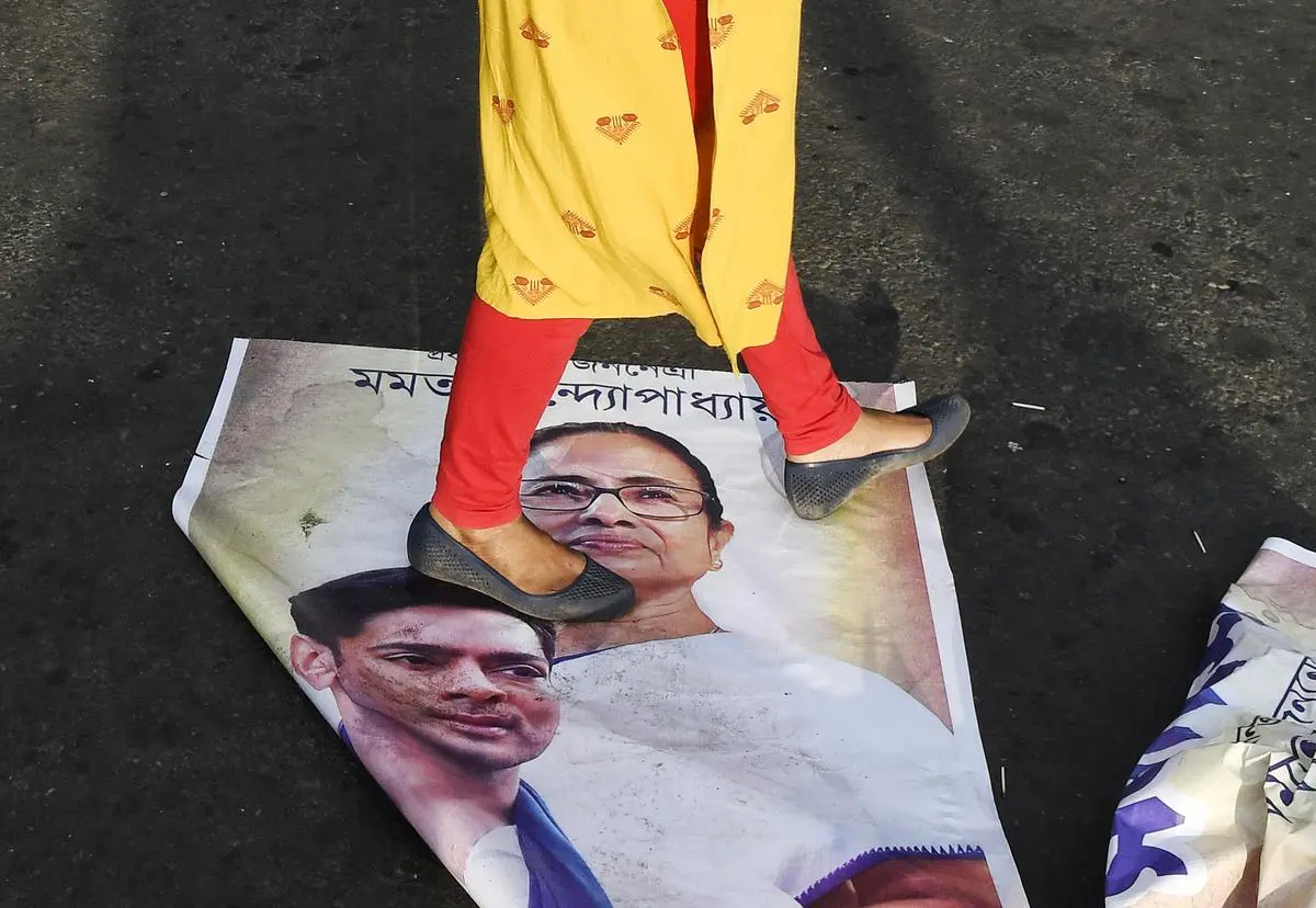 A protester walks over a poster of Chief Minister Mamata Banerjee during the Nabanna Abhiyan, the protest march to the Secretariat held on August 27. A protester walks over a poster of Chief Minister Mamata Banerjee during the Nabanna Abhiyan, the protest march to the Secretariat held on August 27.