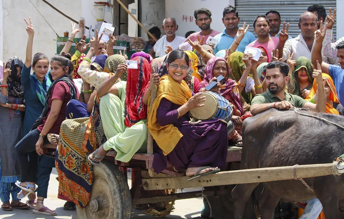 Women voters on their way to cast their votes on a bullock cart, during the second phase of the Lok Sabha election in Bulandshahr, Uttar Pradesh, on April 26. Women voters on their way to cast their votes on a bullock cart, during the second phase of the Lok Sabha election in Bulandshahr, Uttar Pradesh, on April 26.