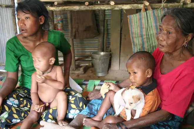 Members of the Shompen community staying in intermediate shelters in the aftermath of the earthquake and tsunami in December 2004. Originally from the Nicobarese settlement at Chingenh, adjoining Galathea Bay, they have been asking to go back to their original habitation and have been steadily refused. Members of the Shompen community staying in intermediate shelters in the aftermath of the earthquake and tsunami in December 2004. Originally from the Nicobarese settlement at Chingenh, adjoining Galathea Bay, they have been asking to go back to their original habitation and have been steadily refused.