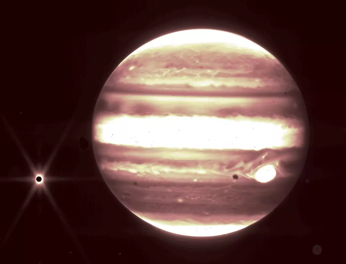 This image released by NASA on September 21  shows Jupiter and its moon Europa as seen through the JWST’s NIRCam instrument 2.12 micron filter. 