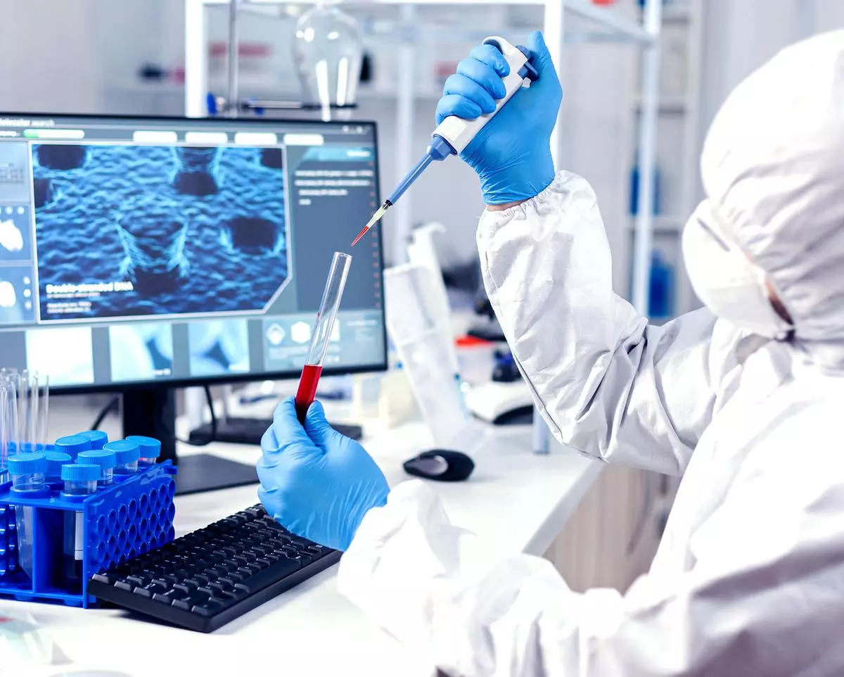 A sample of blood being taken from a test tube at a laboratory where pharmaceutical research is going on in the search for drugs that work against COVID-19.