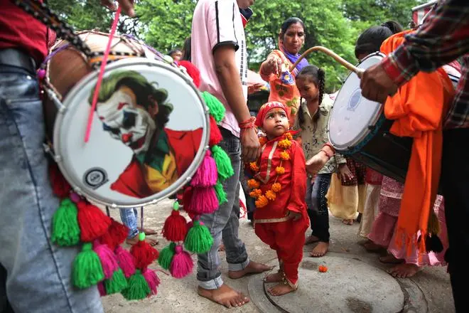 Some of the dholis (drummers) hired by parents of the young Langurs to follow them during the course of the mela. Some of the dholis (drummers) hired by parents of the young Langurs to follow them during the course of the mela.
