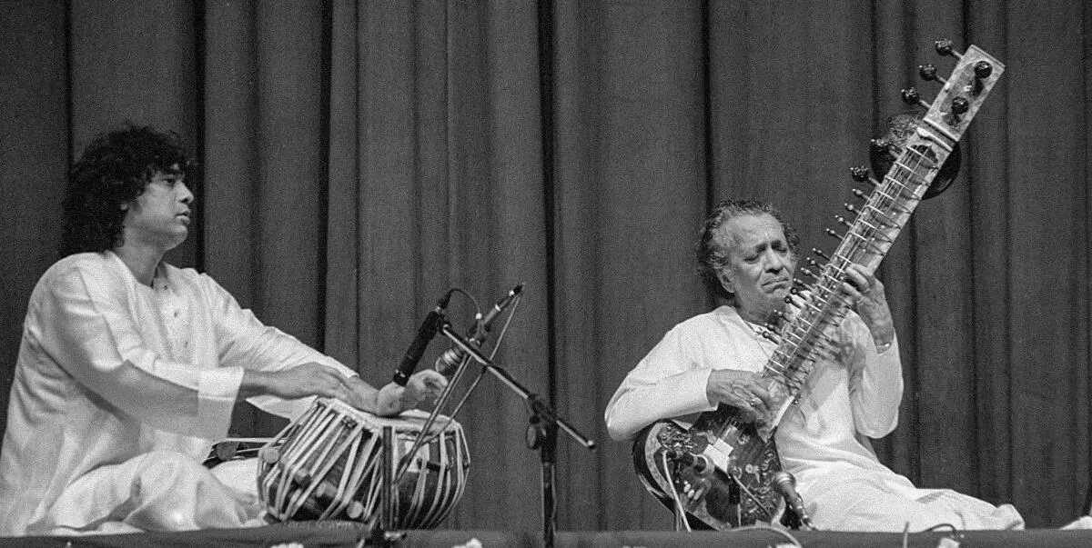 Tabla maestro Ustad Zakir Hussain performs with sitar maestro Pandit Ravi Shankar in New Delhi in February, 1995. Hussain’s father, Allarakha, was internationally famous for his collaborations with Ravi Shankar.  