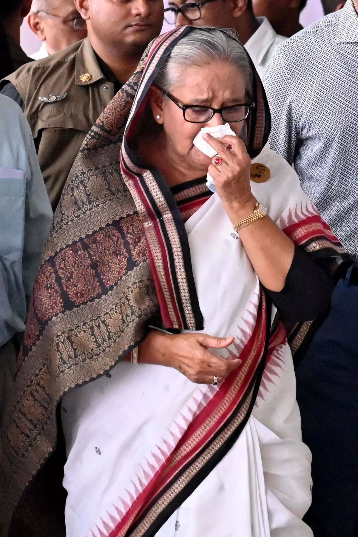 Prime Minister Sheikh Hasina weeps while inspecting the Mirpur metro station in Dhaka, which was vandalised during the protests. 