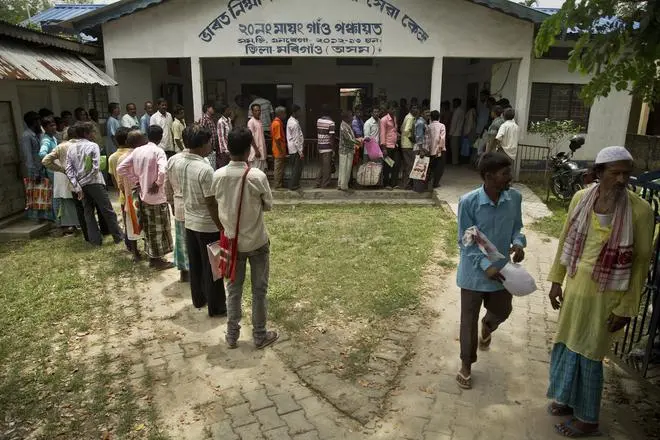 People whose names were left out of a National Register of Citizens draft stand in a queue on August 10, 2018, to collect forms to file appeals in Mayong, 45 kilometres east of Guwahati. People whose names were left out of a National Register of Citizens draft stand in a queue on August 10, 2018, to collect forms to file appeals in Mayong, 45 kilometres east of Guwahati.