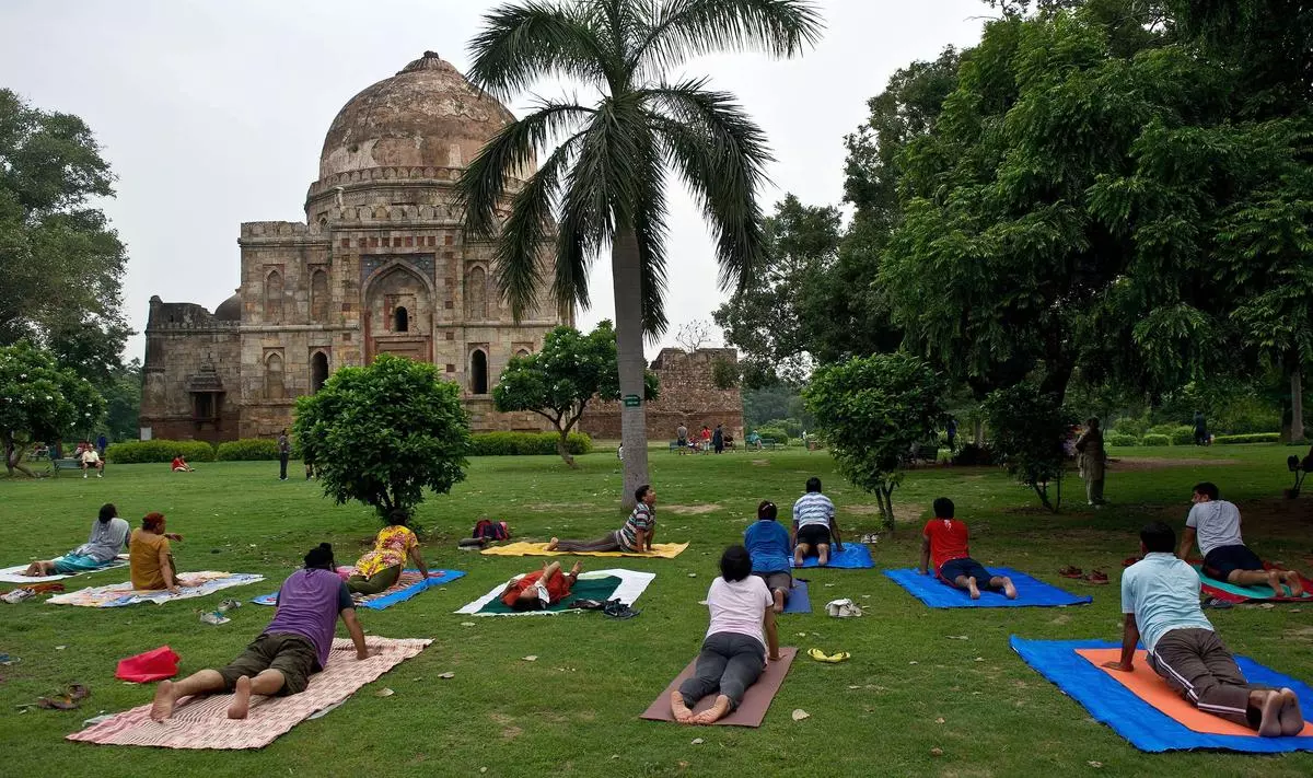 Yoga practitioners at a camp in Lodhi Gardens in New Delhi. The capital contains several architectural works of the Lodhis. The Lodhi dynasty was among many that governed until the Mughals gained power in the early 16th century. File Photo.