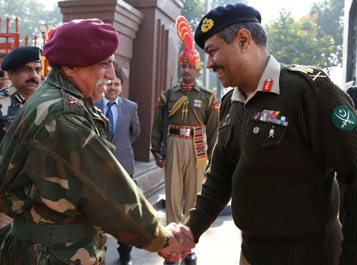 Lieutenant General Vinod Bhatia, Director General of Military Operations (DGMO), with his Pakistani counterpart Major General Aamer Riaz at the Wagah border post on December 24, 2013. The DGMOs held face-to-face talks for the first time in 14 years.