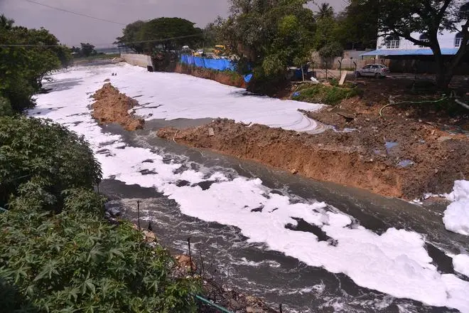 Foam from the Bellandur lake spills on to city streets in September 2018. Foam from the Bellandur lake spills on to city streets in September 2018.