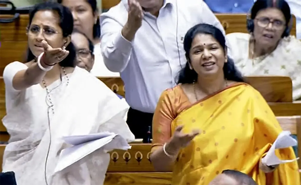 “Women do not want to be worshipped and put on a pedestal but to be treated as equals and have as much right to this Parliament as you do,” DMK MP Kanimozhi said, while commenting on the Bill. NCP MP Supriya Sule is on her right.  