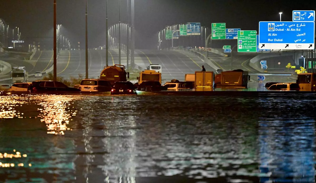 Vehicles are stranded in flood waters along a highway in Dubai.