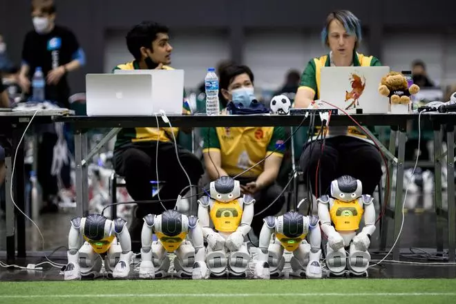 Participants with robots at RoboCup 2022, a Robotics and Artificial Intelligence event in Bangkok in July 2022. 