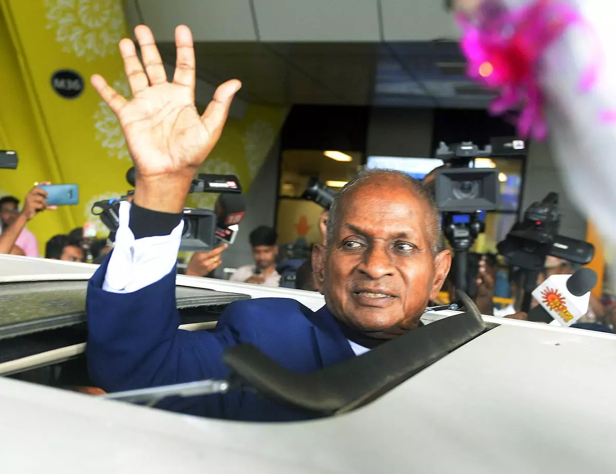 Ilaiyaraaja waves to the gathering as he returns from his Symphony performance in London.  Chennai, March 10.