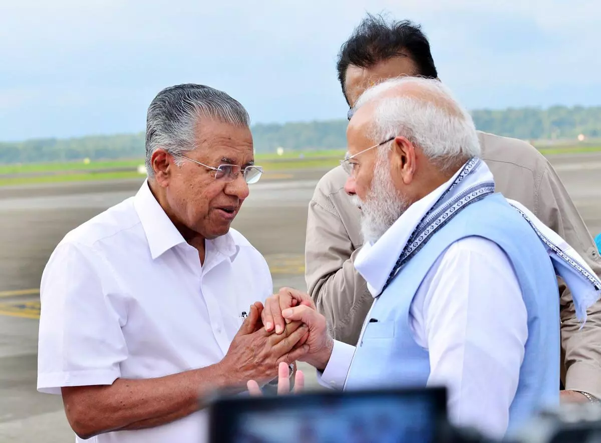 Chief Minister Pinarayi Vijayan with Narendra Modi at Kannur airport just before the Prime Minister left for Delhi after visiting the landslide-hit places on August 10.