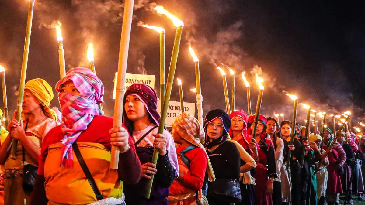Protestors take part in a Meira (torch) rally at Koirengei, organised under the aegis of Coordinating Committee on Manipur Integrity (COCOMI), demanding justice regarding the Tronglaobi killing incident, in Imphal East. Women and children remain among the worst affected, with documented cases of disrupted vaccination, long-distance travel for medical care, and loss of livelihoods since 2023.