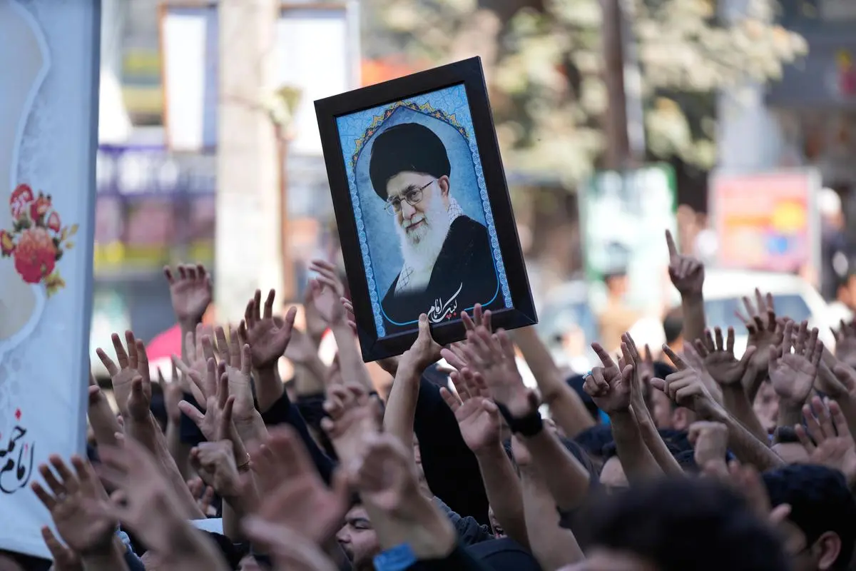 Shiite Muslims hold an image of Ayatollah Khamenei during a protest against the US and Israel, in Jammu on March 1, 2026.