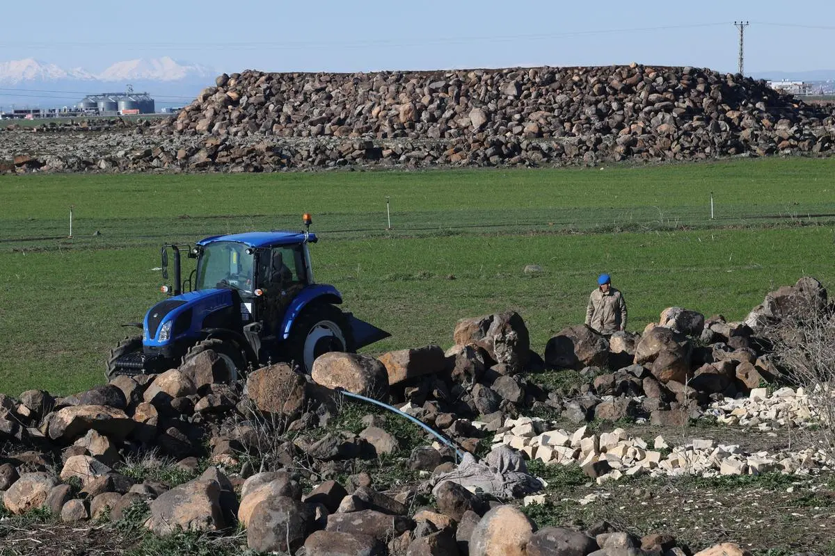 A Turkish army personnel walks as they search a field after a piece of ammunition fell following the interception of a missile launched from Iran by a NATO air defence system, in Diyarbakir, Türkiye, on March 9, 2026.