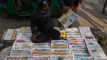 At a bus stop in Delhi in on January 6, 2019. Print media in India is still growing, but faces stiff challenges from new age media.