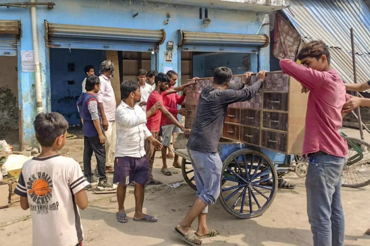 Residents of the area vacated their shops after the Department of Public Works posted notices on several properties, asking for the removal of all illegal structures and warning of activities in the violence-hit Maharajganj area in Bahraich, Uttar Pradesh, on October 19, 2024. 