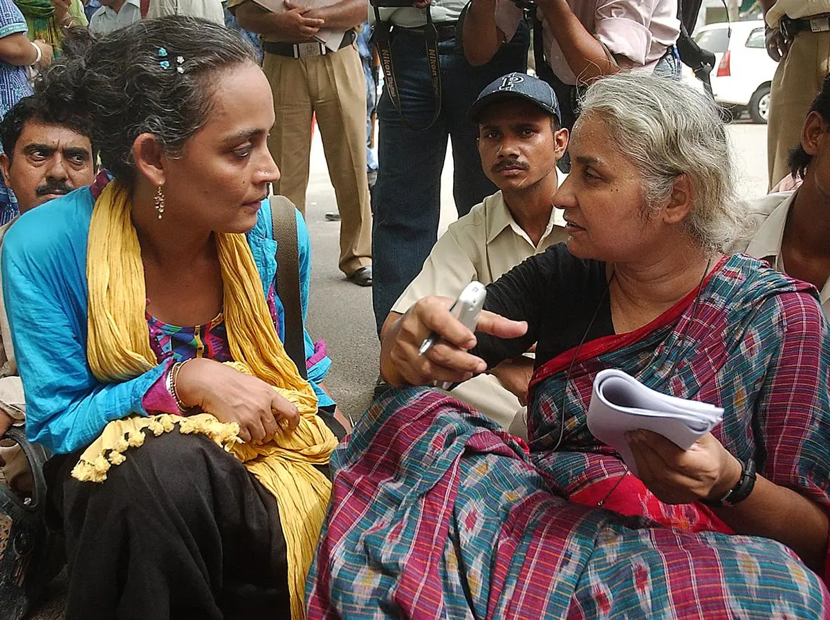 Arundhati Roy and the Narmada Bachao Andolan leader Medha Patkar with other activists at a demonstration in New Delhi on May 9, 2006.  Roy has exposed “the great project of unseeing” the injustices and ventured into forests, across rivers and dams, down through contested valleys to tell us of lives at the borders of our cities.