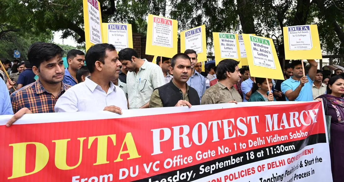 Teachers protest against “anti-education” policies at Delhi University on September 18, 2024. Many lecturers have taught for years—sometimes decades—without fair pay, benefits, or recognition as regular faculty.