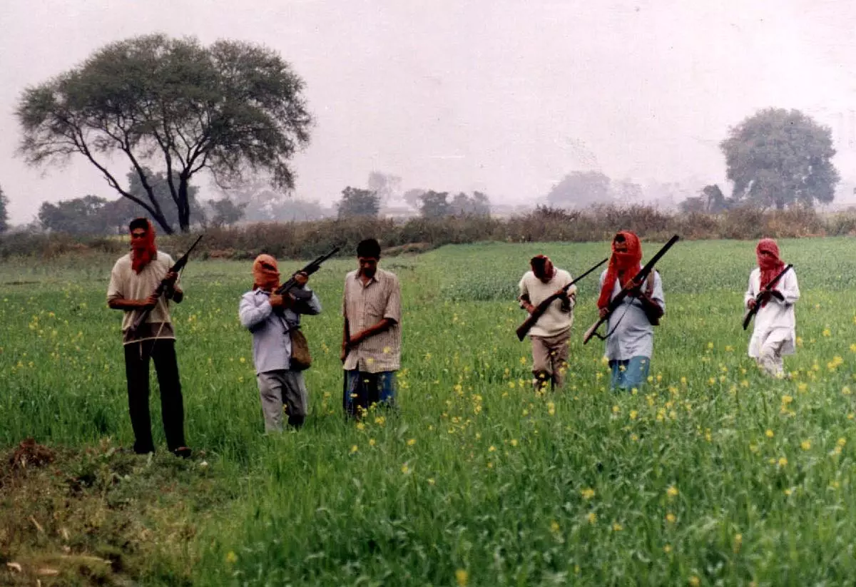 Naxalites in a sunflower field on the outskirts of Patna, a 2001 picture. For the people here, naxalism at the time was a living idea rooted in the practical realities of oppression and survival. 