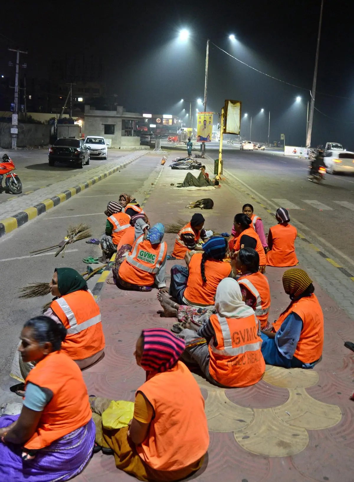 The permitting of night shift for women, hitherto prohibited under the Factories Act, actually offers greater freedom to employers to extract labour from women under conditions that are inherently unsafe and unequal. Here, sanitation workers brave a cold December night in 2024 to take up work after midnight on the beach road  in Visakhapatnam.