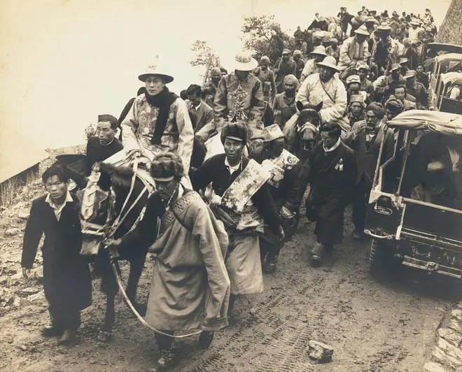 “The Dalai Lama in ceremonial dress enters India through a high mountain pass”, Sikkim, 1956. “The Dalai Lama in ceremonial dress enters India through a high mountain pass”, Sikkim, 1956.