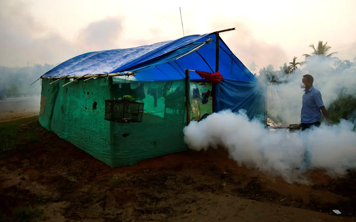 A health worker carrying out fogging operations in the flood-affected Morigaon district of Assam on May 23. 
