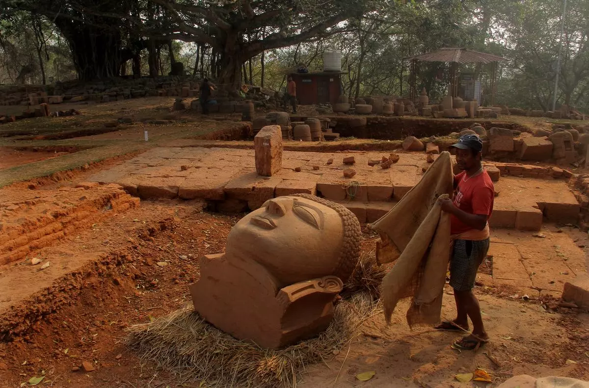 A worker near a newly excavated Buddha’s head inside the ancient Ratnagiri Monastry in Odisha, on February 15, 2025. Buddhism’s philosophical journey had begun with Nagarjuna’s Shunyavad (emptiness doctrine). 