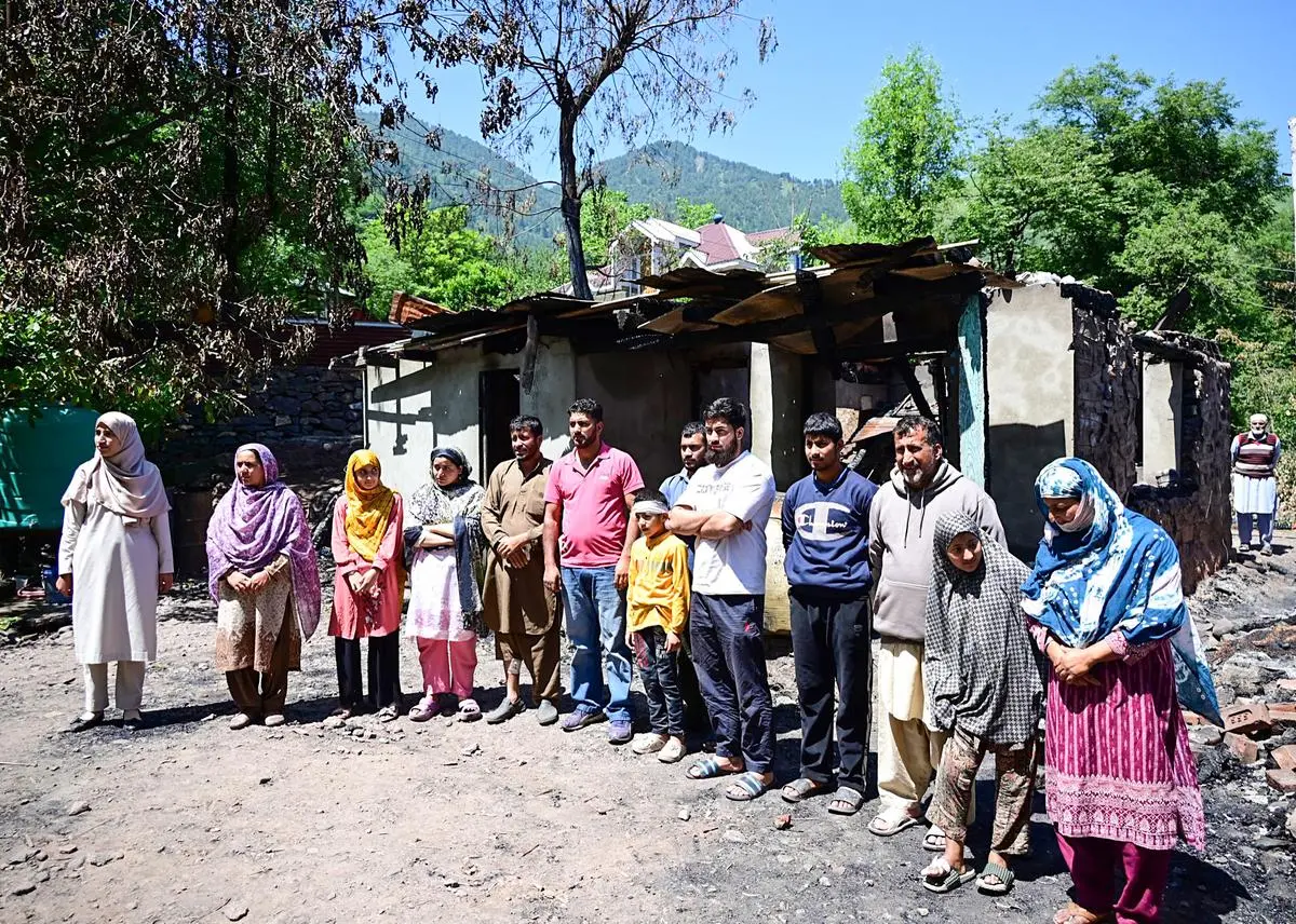 Kashmiri people affected by Pakistani shelling gathered ahead of the visit of Jammu and Kashmir Chief Minister Omar Abdullah, at Uri in Baramulla, on May 14. Kashmiri people affected by Pakistani shelling gathered ahead of the visit of Jammu and Kashmir Chief Minister Omar Abdullah, at Uri in Baramulla, on May 14.