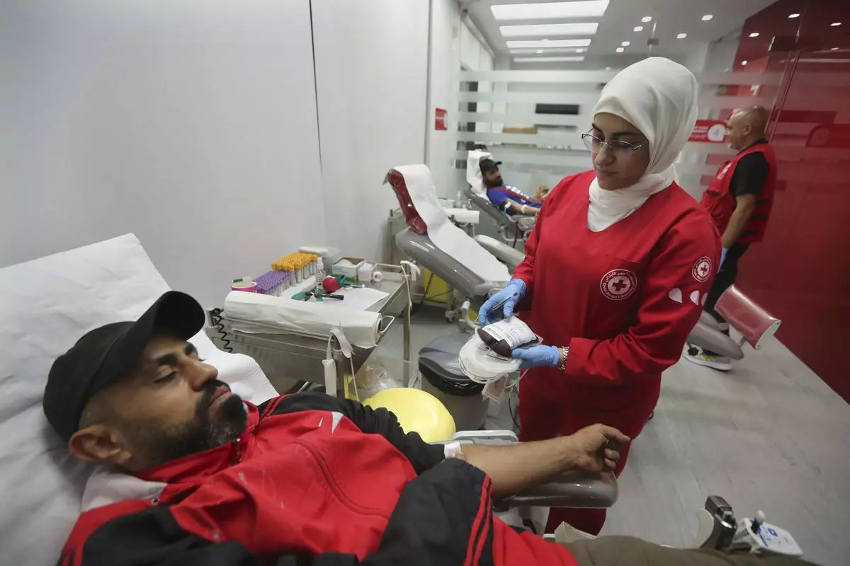 People donate blood for those who were injured by their explosions, at a Red Cross centre, in the southern port city of Sidon, Lebanon, September 17, 2024. 