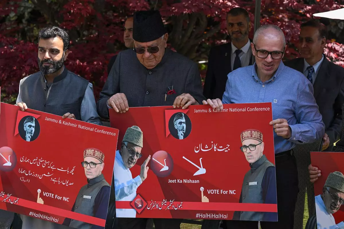 Former Jammu and Kashmir chief minister and Vice President of the National Conference (NC) party Omar Abdullah (R), NC President Farooq Abdullah (C) and party senior leader Aga Syed Ruhullah Mehdi in Srinagar on April 12, 2024.