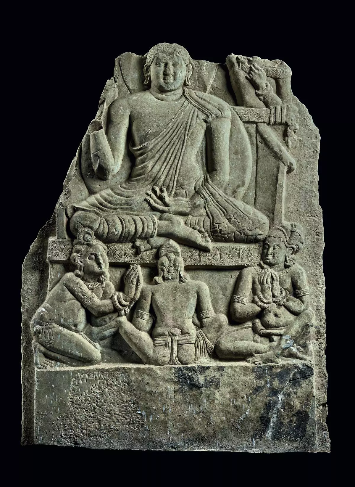 Limestone sculpture of an enthroned Buddha with worshippers, excavated in 1926, Goli, Andhra Pradesh, circa 3rd century BCE. Government Museum, Chennai.                        
