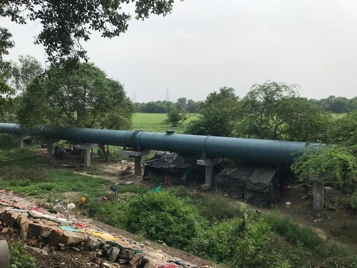 Houses covered by tarpaulin showcase the grim reality of those from underprivileged backgrounds