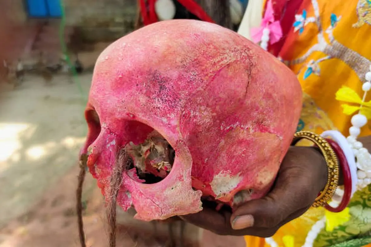 A human skull held by a ‘tantrik’ who spreads superstition and witchcraft. A human skull held by a ‘tantrik’ who spreads superstition and witchcraft.